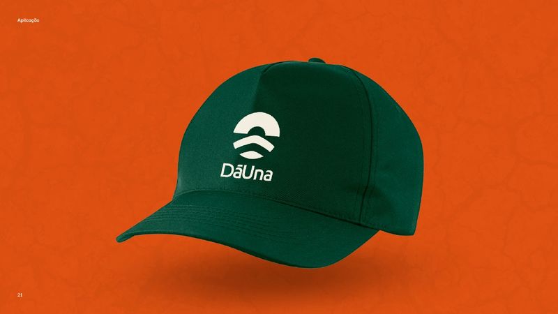 Green cap with the DāUna symbol and wordmark embroidered in beige