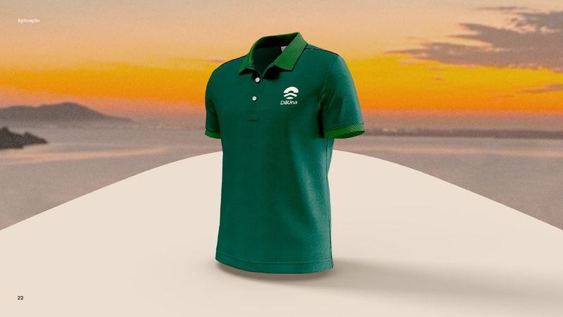Green polo shirt with the DāUna brand applied on the chest